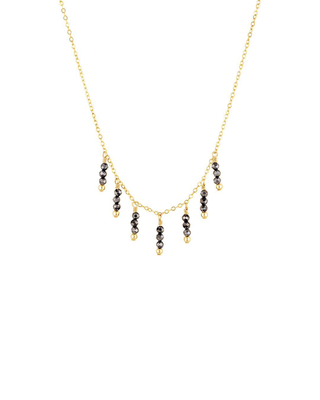 Necklace with black spinel gemstones on a gold chain against a white background