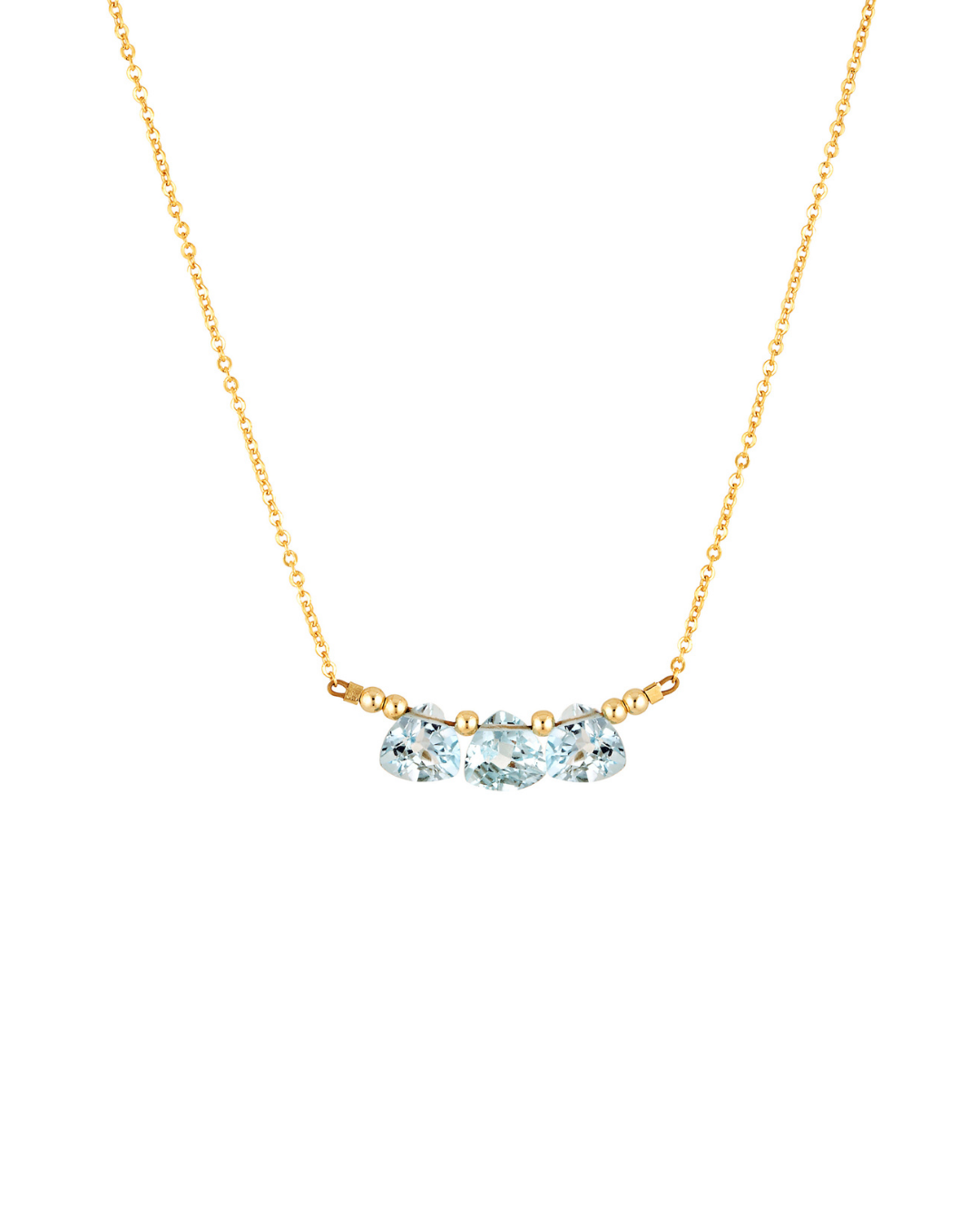 Gold necklace with three blue topaz gemstones on a white background