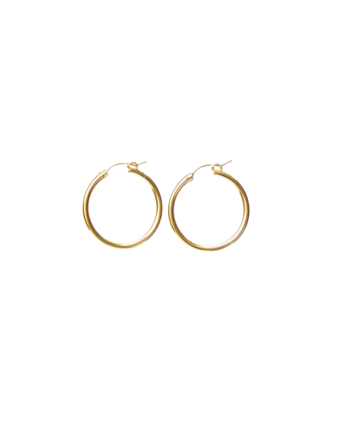 Gold hoop earrings on a white background