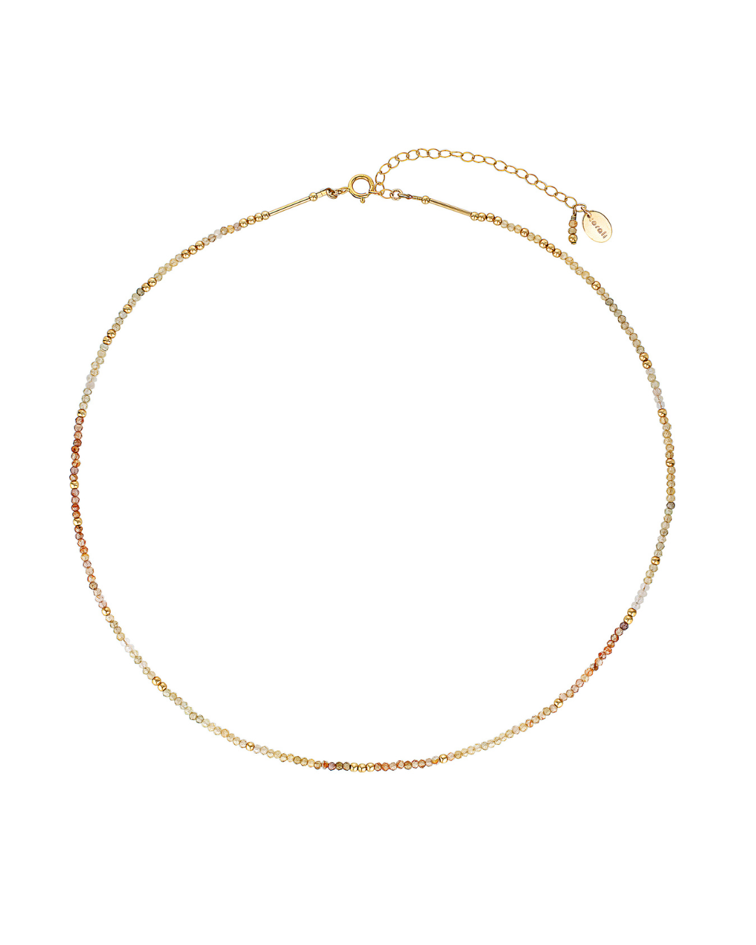 Gold necklace with zircon gemstones on a white background