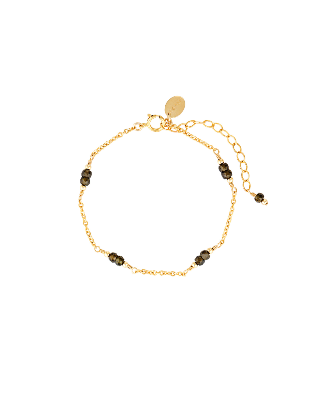 Gold chain bracelet with dark green zircon gemstones on a white background