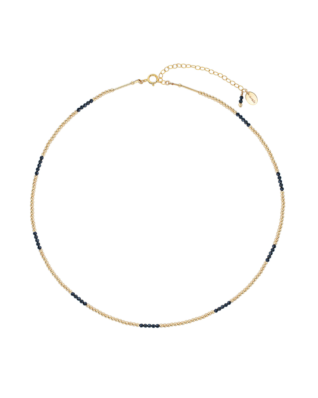Gold beaded necklace with black spinel gemstones on a white background