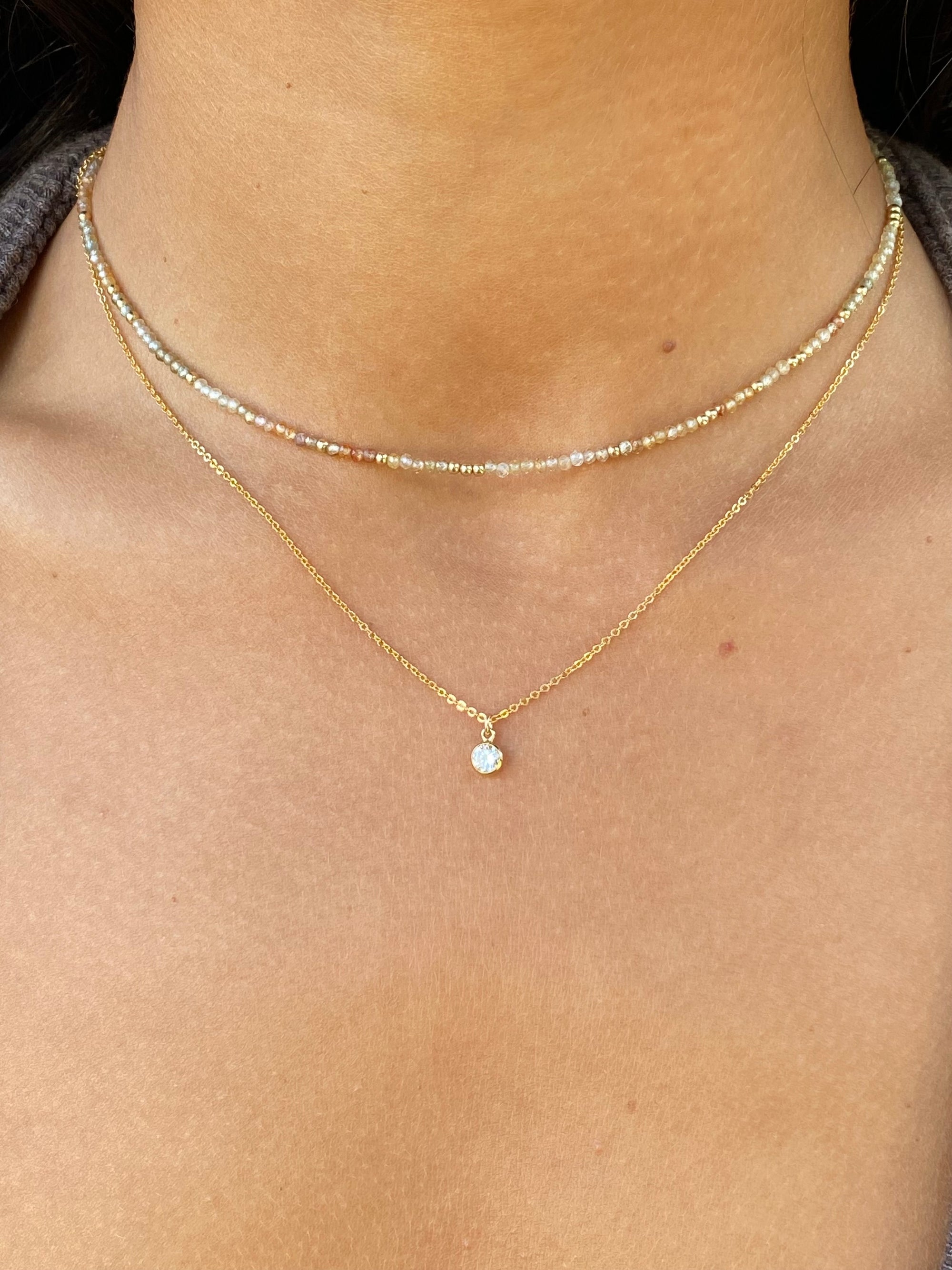 Gold necklace with a cubic zirconia
