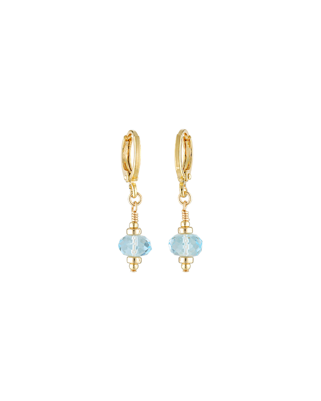 Gold hoop earrings with blue topaz gemstones on a white background